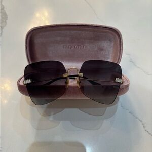 Miu Miu Black Sunglasses with Gold Accents